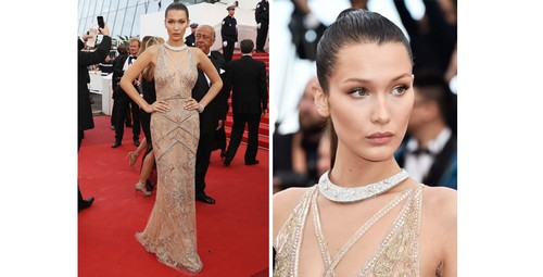 Bella Hadid chegou radiante com um longo assinado por Roberto Cavalli, que foi arrematado por uma gargantilha de brilhantes, cumprindo a função de uma gola