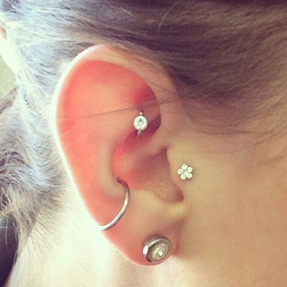 Conch tragus hook piercing